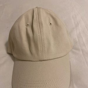 Beige hat with blue strap
